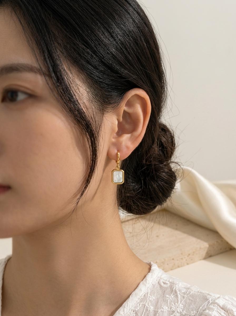 The Aurelia Emerald cut MOP Huggies